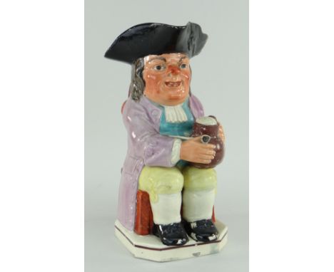 STAFFORDSHIRE PEARLWARE TOBY JUG of 'Wood' type circa 1790, seated with frothy jug of ale, clay pipe and black tricorn hat, 2