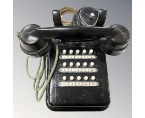 A Bakelite and lacquered metal telephone with bell. 