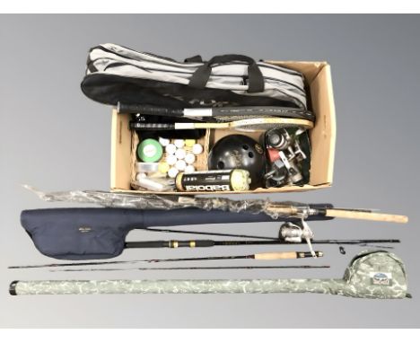 A group of fishing rods, tennis rackets, golf balls, fishing reels, bowling ball etc 