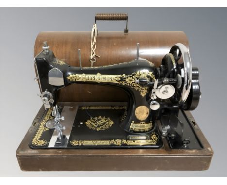 A Singer hand sewing machine, in box.