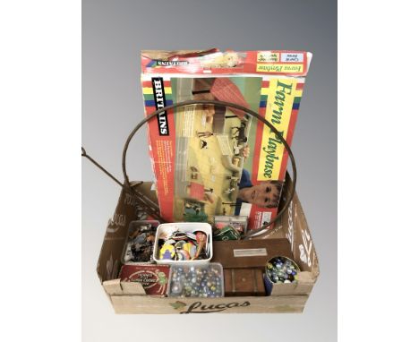 Assorted glass marbles, vintage painted die cast farm animals, badges, playing cards, Britains model farm, child's metal hoop
