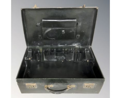 An early 20th century leather vanity case with fitted interior, width 61 cm.