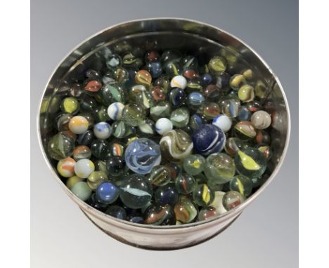 A tin of vintage glass marbles 