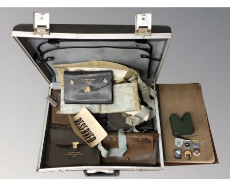 A briefcase of Masonic ephemera, silver gilt medal and two others, books and satchels etc 