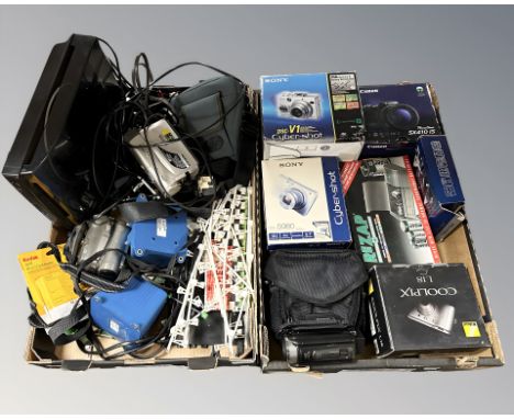 Boxed digital cameras including Sony and Canon, video cameras, turn table, other electricals (two boxes) 