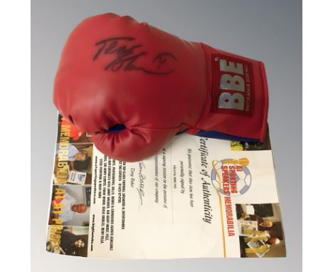 A boxing glove signed by Frank Bruno with certificate of authenticity 