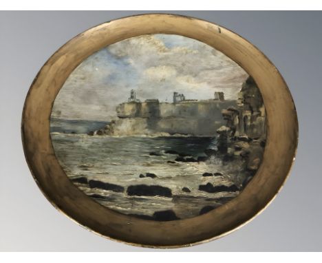 An early 20th century oil painting on ceramic plaque depicting the coast at Tynemouth with the Abbey beyond, diameter 55 cm.