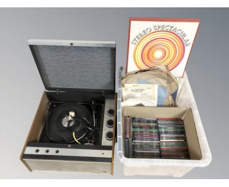 A vintage record player and a box containing assorted LP records, 78s and CDs. 