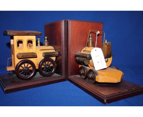 LOT OF 20TH CENTURY WOODEN TOYSincluding a pair of bookends modelled as a steam engine, set of figures in a cabinet and a col