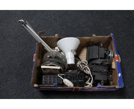 A box of angle poise lamp, vintage projectors and film reels 