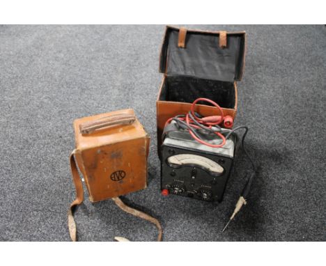Two vintage universal AVO meters, both in leather carry cases