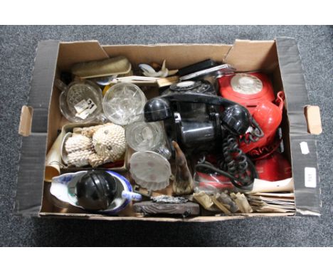 A box of glass ware, vintage telephones, tourist pieces etc 