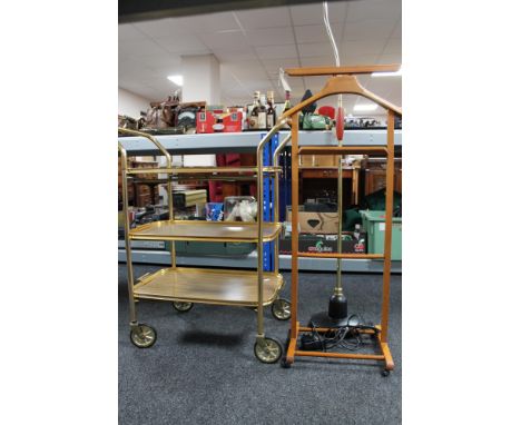 A gilt metal three tier trolley together with a gent's valet stand and angle poise lamp 