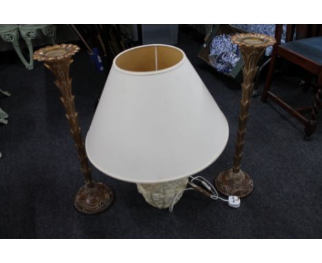 A stone effect Grecian style table lamp with shade together with a pair of gilt wood candle holders 