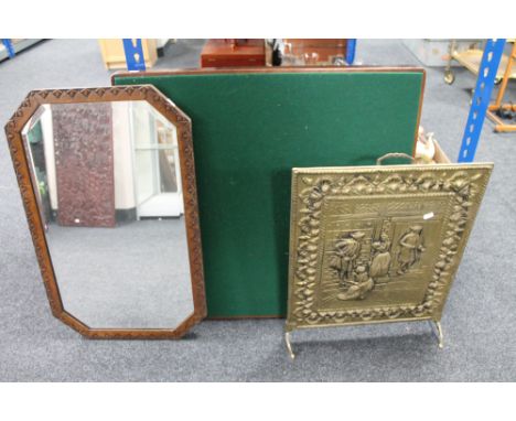 An Edwardian oak framed mirror together with a brass fire screen and a folding card table 