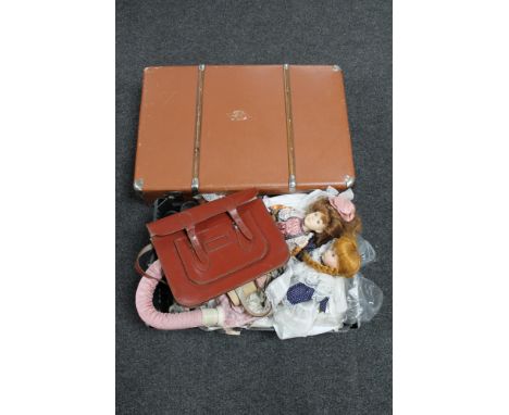 A luggage case together with a box of leather satchel, vintage hair dryer, ankle boots, porcelain headed dolls