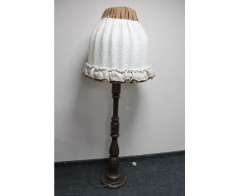 A stained beech standard lamp with mushroom shade 