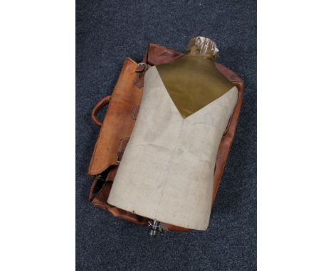 A vintage mannequin torso together with a leather valise 