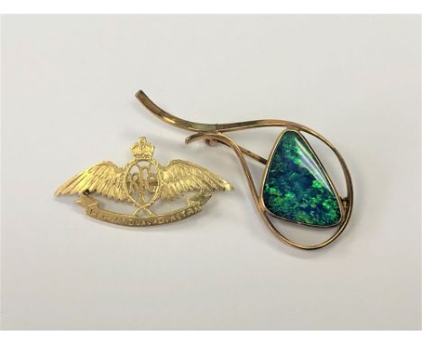 A yellow metal opal brooch and a Royal Flying Corps brooch