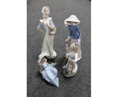 Four Nao figures depicting lady's and children 
