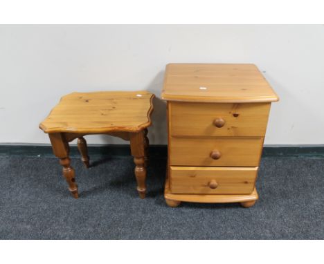 A pine three drawer chest and a lamp table 