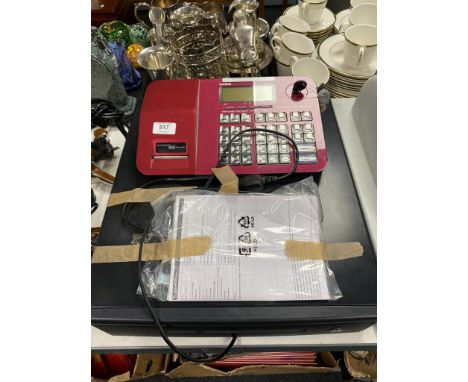 A Casio SE-S700 cash register with instructions and keys 