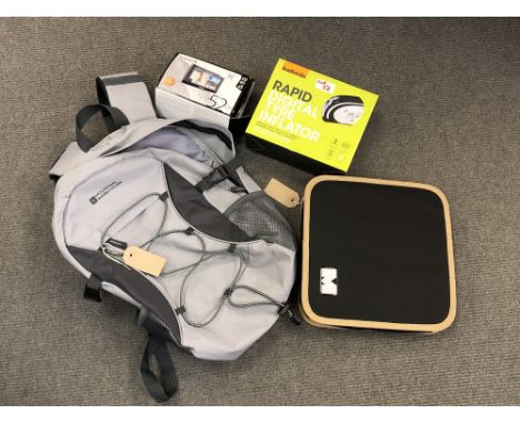 A Mountain Warehouse day-pack together with a boxed Halfords Rapid Digital Tyre Inflator, a boxed Garmin nuvi 52 LM satnav (c