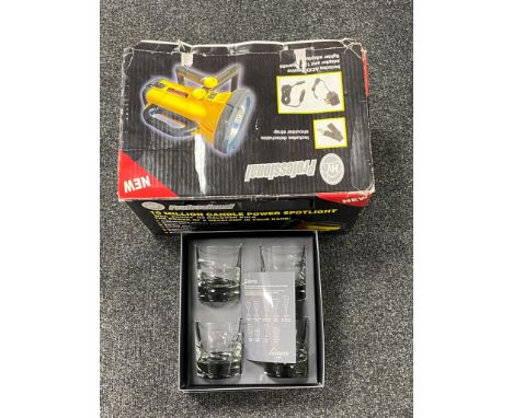 A boxed Professional 10 million candle power spot light together with a boxed set of linear crystal tumblers 