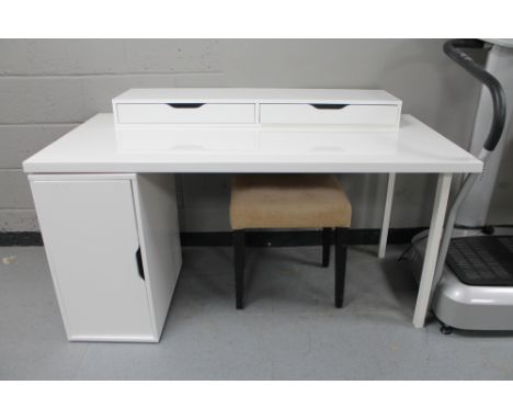 A contemporary white single pedestal computer desk with three tier shelf and dressing table stool