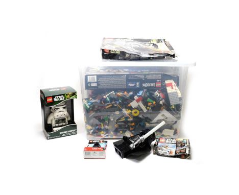 Star Wars LEGO sets and figures, including: Darth Vader’s TIE fighter set; a Kylo Ren LEDlite keyring; a Stormtrooper alarm c