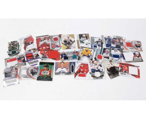 Twenty-Six Ice Hockey collectors trading cards, by Upper Deck, and others, all event-used (match worn) relic patch cards, som
