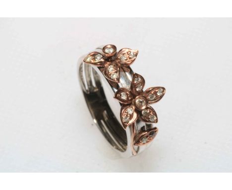 Flower design nineteen stone diamond cluster ring set in 9 carat yellow gold, size L.