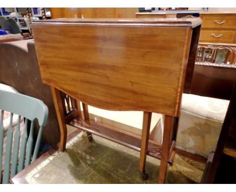 Small Mahogany dropleaf table with ceramic casters. Not available for in-house P&amp;P 