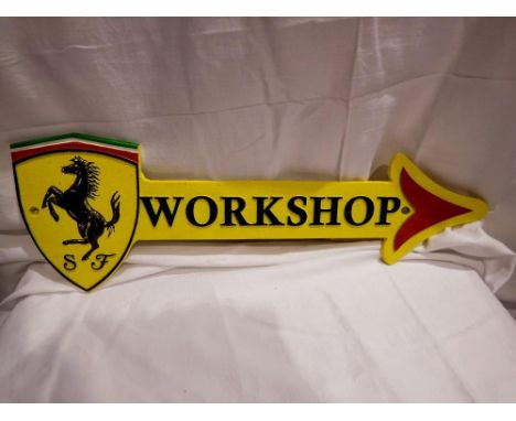 Cast iron Ferrari workshop arrow sign, W: 45 cm. P&amp;P Group 1 (£14+VAT for the first lot and £1+VAT for subsequent lots) 