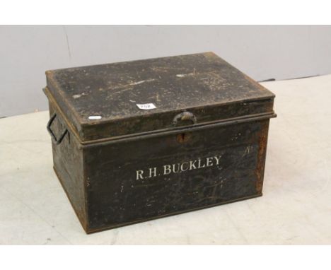 A vintage metal box containing a quantity of tools