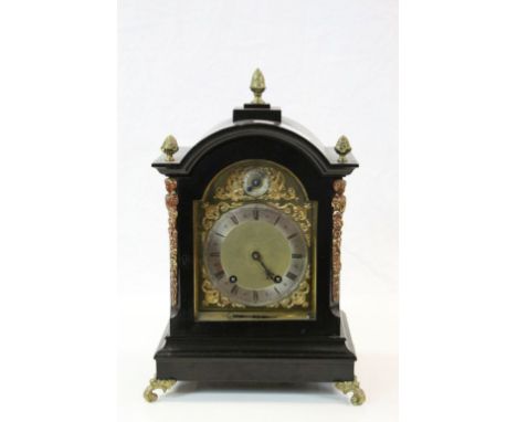 Ebonised Wooden cased Bracket Clock with ornate surround to the metallic dial with is marked "Pain Folkestone", movement mark