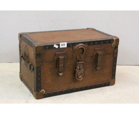 A small vintage waxed travelling trunk 