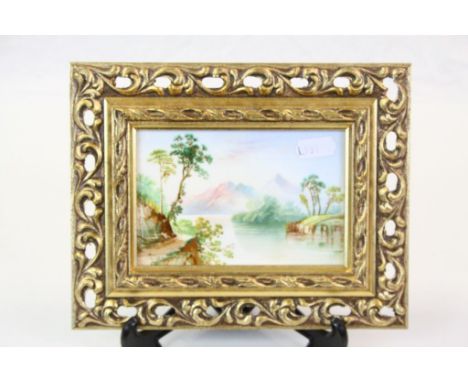 Gilt framed Hand painted Ceramic Tile depicting a Lake scene with Mountains, frame approx 22 x 17cm