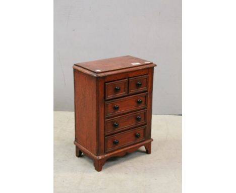 Stained Pine Table Top Cabinet in the form of a 19th Century Chest of Two Short over Three Long Drawers on Bracket Feet, 47cm