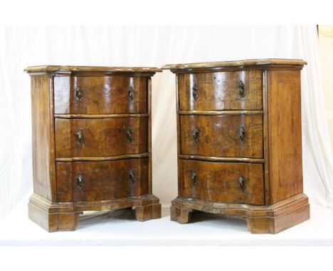 Pair of Italian Walnut Chests, the moulded serpentine cross-banded tops above three drawers, raised on ogee bracket feet, par