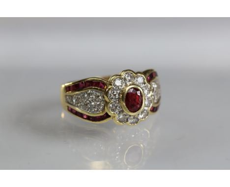 A contemporary 18 carat Yellow Gold, Ruby and Diamond Dress Ring,the oval shaped ruby central stone within a surround of ten 