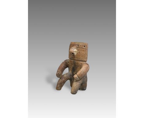 A Qimbaya Culture â€˜retabloâ€™ figure. Colombia ca. 1000-1400 AD.The terracotta seated figure with slab type body, arms rest