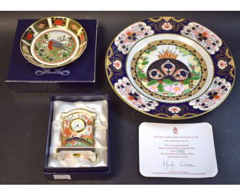 A Royal Crown Derby Christmas plate, Limited Edition, certificate; a miniature mantel clock, second, boxed; a Robin trinket d