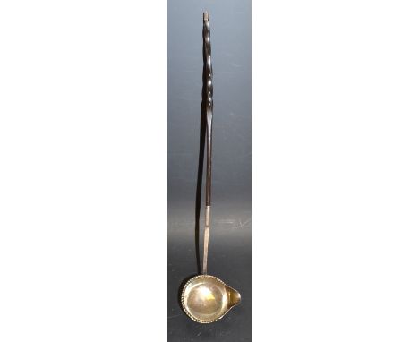 A 19th century silver toddy ladle, spiralled whale bone handle, spouted bowl, faint marks