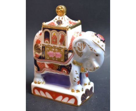A Royal Worcester Connoisseur Collection Nelson Elephant candle snuffer, decorated in the Imari palette