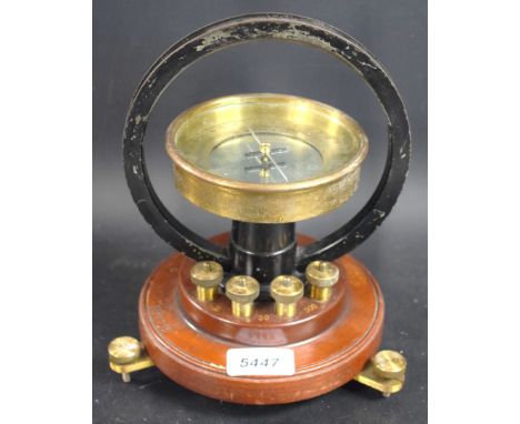 A mahogany and brass tangent galvanometer, by W G Pye & Co, Cambridge, 10.5cm silvered register, circular base, stamped No. 8