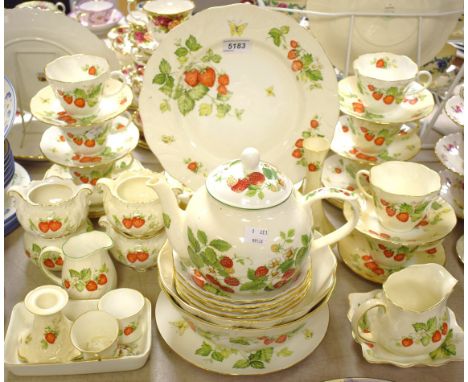 A Queen`s china Virginia Strawberry pattern tea service comprising tea plates, salad plates, bowls; cake plates; cream jug; s
