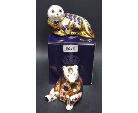 A Royal Crown Derby paperweight, Harbour Seal, limited edition 3,633/4,500; another, Seated Bear, both with gold stopper (2)