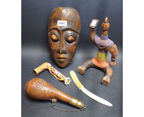 Tribal Art - a hardwood mask, 25.5cm high;  a Columbian hardwood and beadwork figure, 24cm high;  a camel testicle powder fla