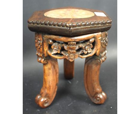 A small Chinese padouk wood hexagonal jardiniere stand, beaded top with inset rouge marble roundel, above a deep frieze pierc